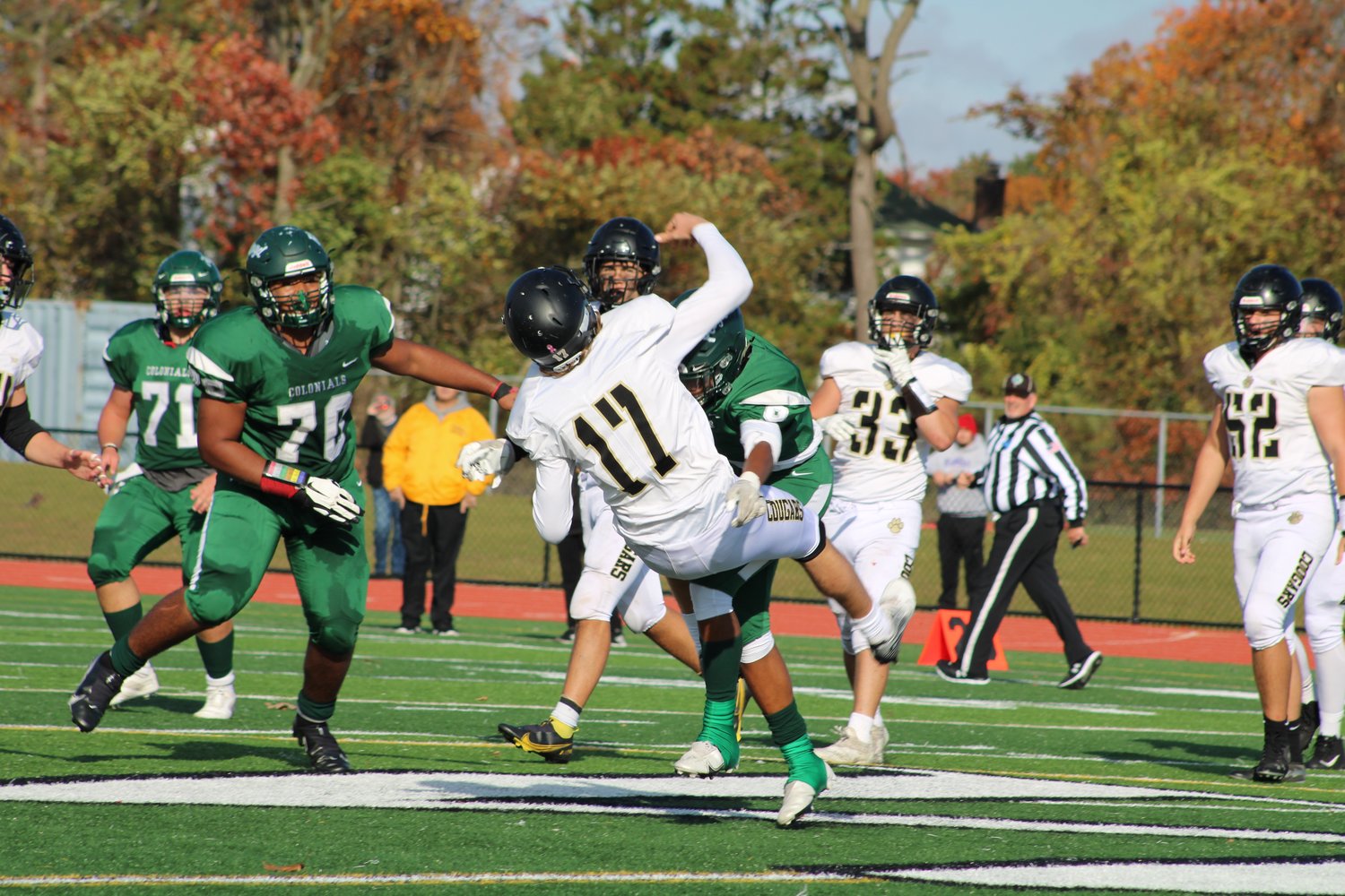 Sonny Mayo delivers a big hit on the Commack quarterback in a 31-16 semifinal victory.